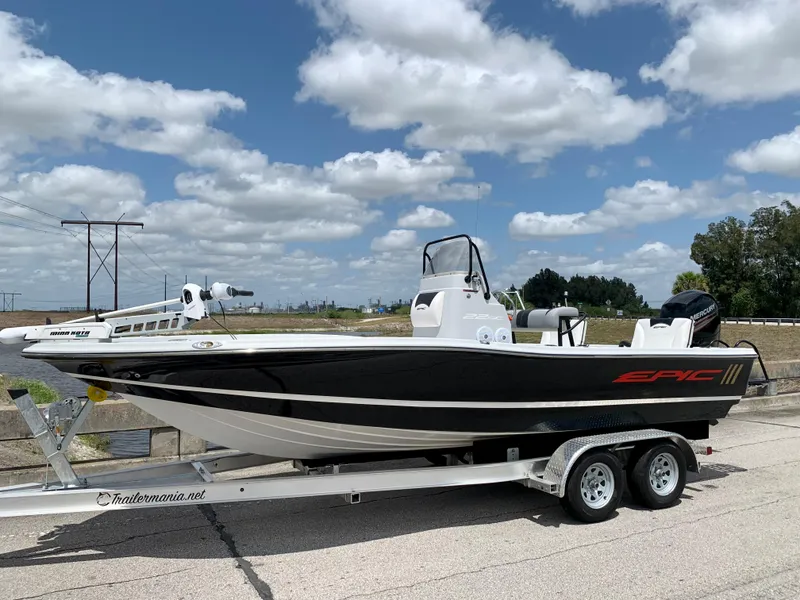 Slide: The Image of 2015 Epic 22SC Bay Boat on trailer under blue sky with clouds. - 6