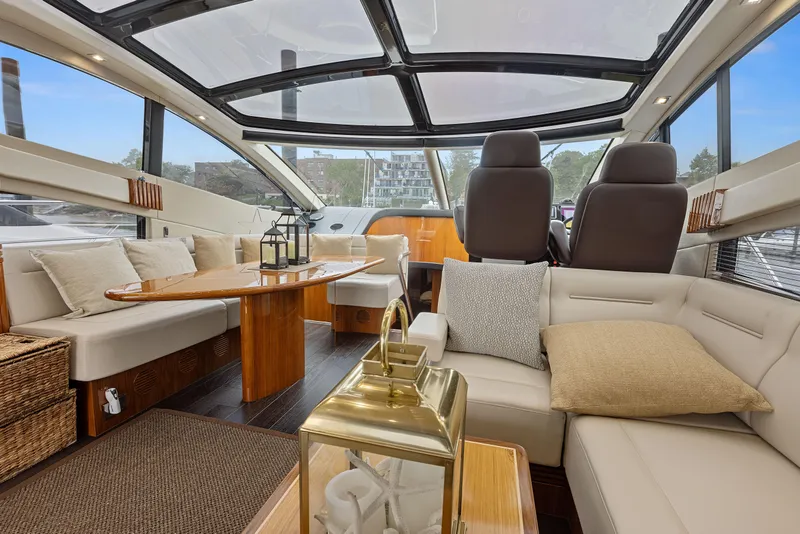 Slide: The Image of Luxurious interior of 2015 Sunseeker Predator 68 yacht with plush seating and panoramic windows. - 15