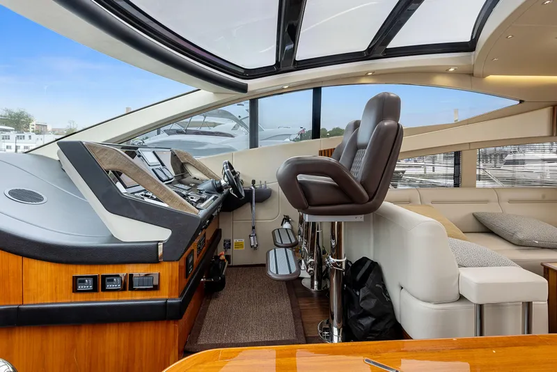 Slide: The Image of Interior helm of 2015 Sunseeker Predator 68 yacht with leather seats and panoramic windows. - 18
