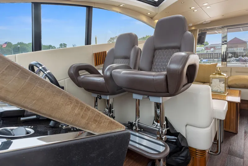 Slide: The Image of Interior helm seating of 2015 Sunseeker Predator 68 yacht with luxurious leather chairs. - 19