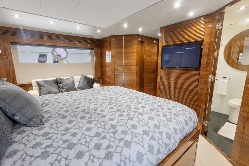 Slide: The Image of Luxurious bedroom in 2015 Sunseeker Predator 68 yacht with TV and ensuite bathroom. - 28