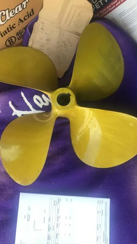 Slide: The Image of Yellow boat propeller for 2008 Sea Ray 44 Sundancer on purple surface. - 11