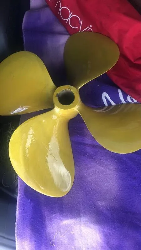 Slide: The Image of Yellow boat propeller for 2008 Sea Ray 44 Sundancer on purple fabric. - 12