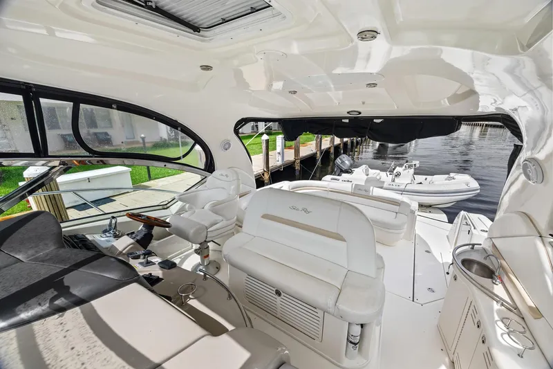 Slide: The Image of Interior view of 2008 Sea Ray 44 Sundancer yacht, featuring luxurious seating and helm. - 18