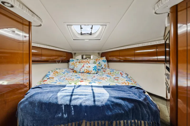 Slide: The Image of Luxurious cabin interior of 2008 Sea Ray 44 Sundancer yacht with colorful bedding. - 24