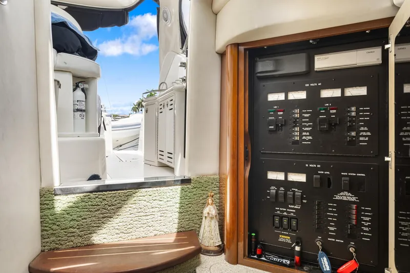 Slide: The Image of 2008 Sea Ray 44 Sundancer interior with control panel and steps to deck. - 28