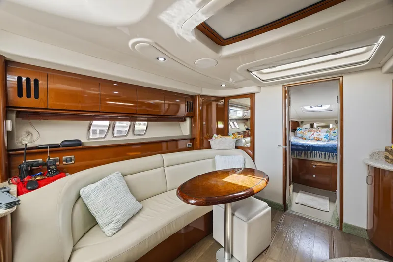 Slide: The Image of Luxurious interior of 2008 Sea Ray 44 Sundancer yacht with elegant seating and wood finishes. - 30