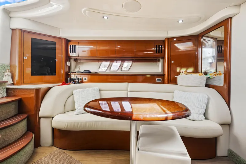 Slide: The Image of Luxurious interior of 2008 Sea Ray 44 Sundancer yacht with elegant seating and wooden table. - 36
