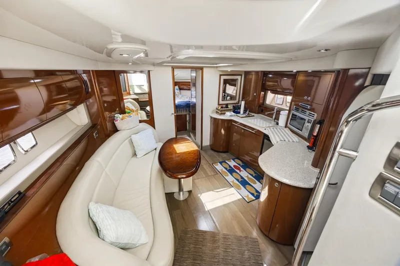 Slide: The Image of Luxurious interior of 2008 Sea Ray 44 Sundancer yacht with modern kitchen and seating area. - 37