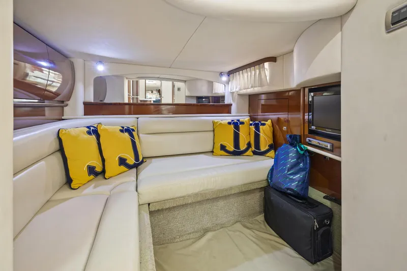 Slide: The Image of Interior of 2008 Sea Ray 44 Sundancer yacht with cozy seating and nautical-themed decor. - 38