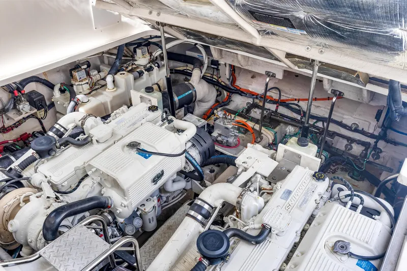 Slide: The Image of Engine room of 2008 Sea Ray 44 Sundancer yacht, showcasing dual engines and mechanical components. - 41