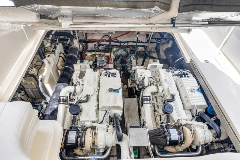 Slide: The Image of Engine room of 2008 Sea Ray 44 Sundancer yacht, showcasing dual engines and mechanical components. - 43