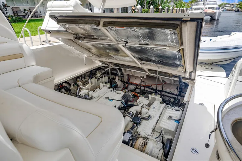 Slide: The Image of 2008 Sea Ray 44 Sundancer engine compartment with open hatch, showcasing mechanical components. - 44