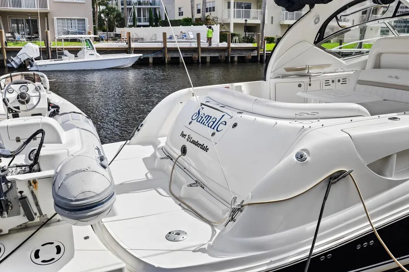 Slide: The Image of 2008 Sea Ray 44 Sundancer yacht docked at marina, featuring spacious deck and elegant design. - 8