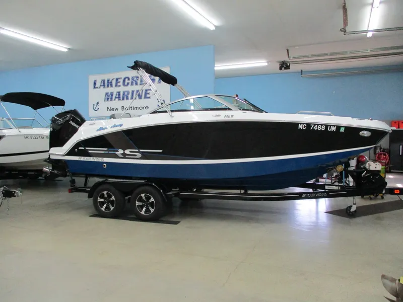 The Image of 2021 Four Winns HD3 RS boat in a showroom. - 1