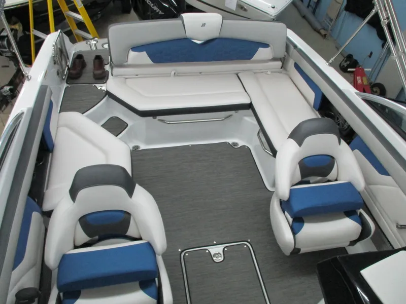 Slide: The Image of Interior of 2021 Four Winns HD3 RS with blue and gray seating. - 11