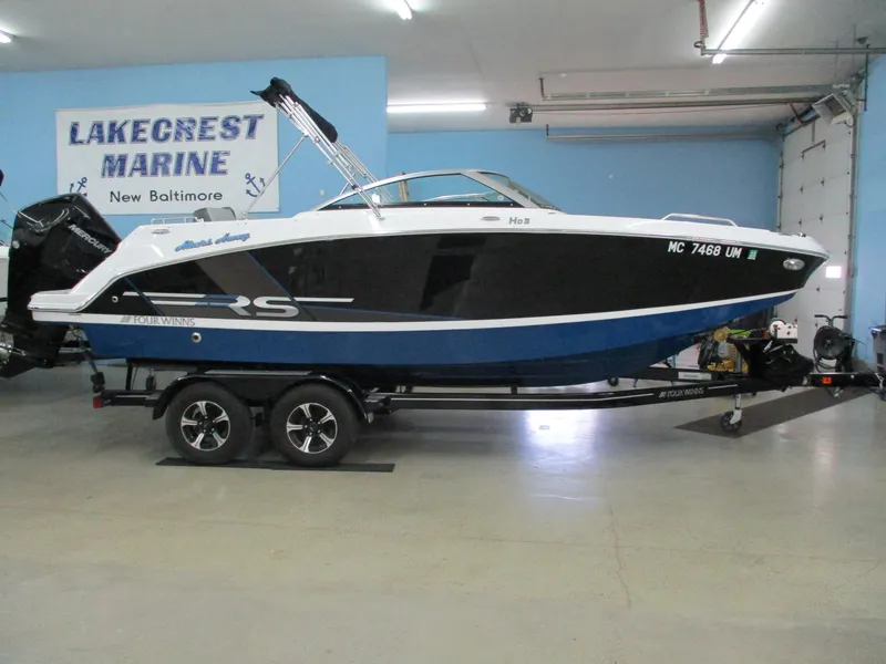 Slide: The Image of 2021 Four Winns HD3 RS boat in a workshop. - 2