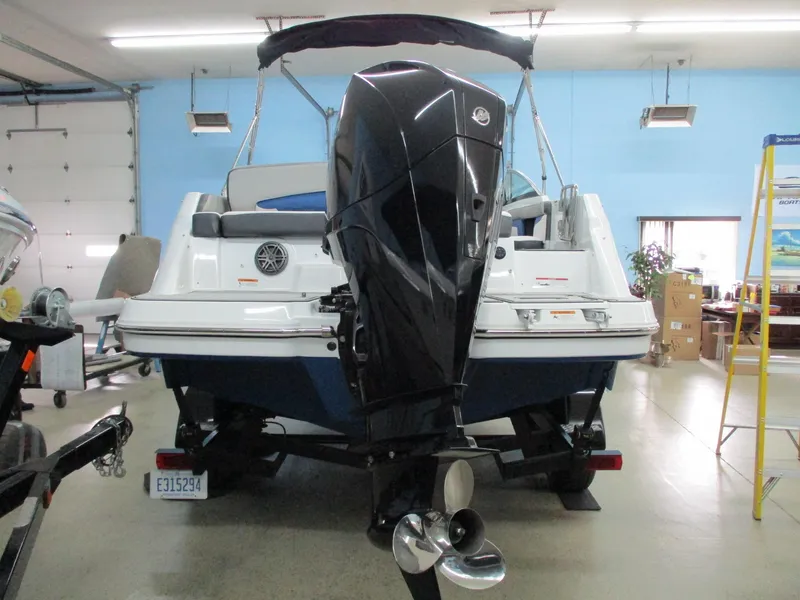 Slide: The Image of 2021 Four Winns HD3 RS boat indoors with outboard motor. - 4