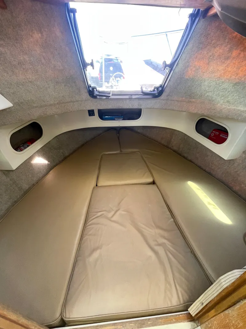 Slide: The Image of Interior cabin of a 1984 Farallon 25 Whaleback boat with cushioned seating. - 21