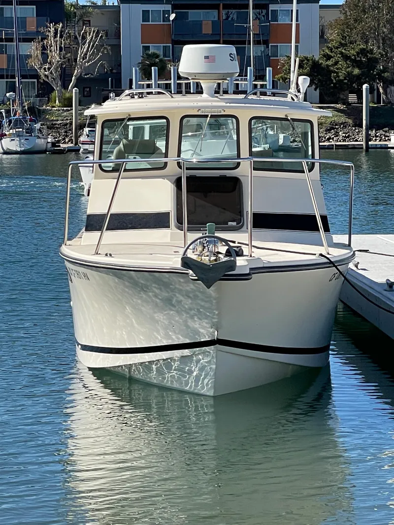 Slide: The Image of 1984 Farallon 25 Whaleback boat docked in a marina. - 4