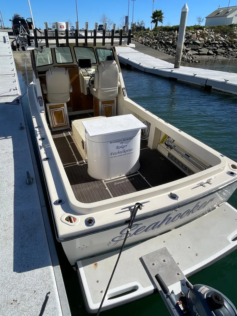 Slide: The Image of 1984 Farallon 25 Whaleback boat docked at a marina. - 8