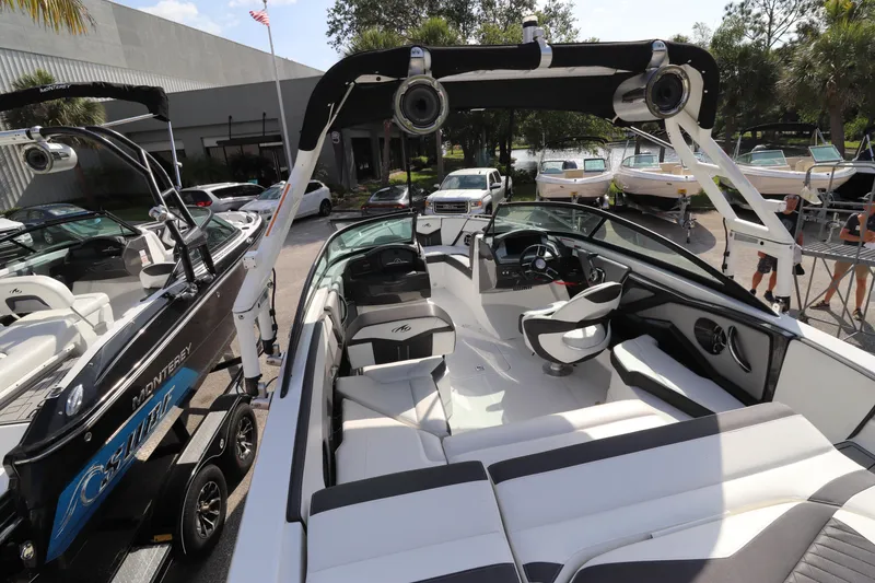 Slide: The Image of 2018 Monterey 238SS boat interior with seating and steering wheel. - 2