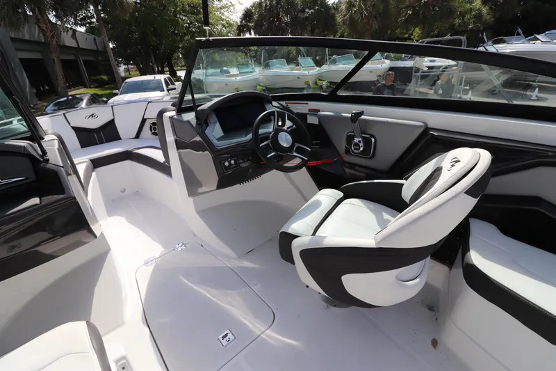 Slide: The Image of 2018 Monterey 238SS boat interior with steering wheel and seating. - 3