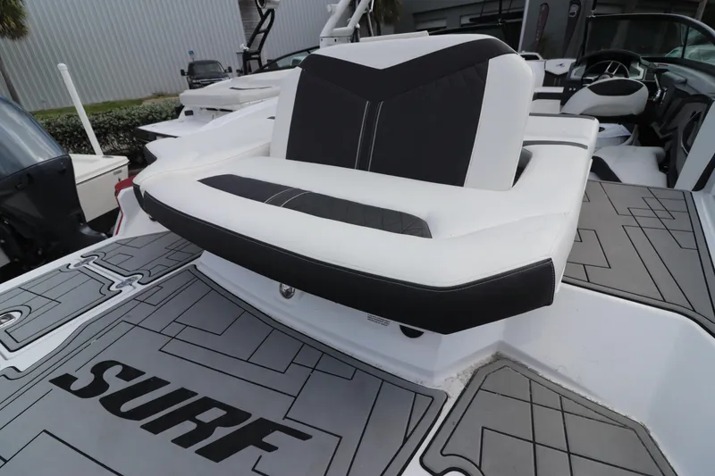 Slide: The Image of 2018 Monterey 238SS boat with black and white seating and SURF deck mat. - 7