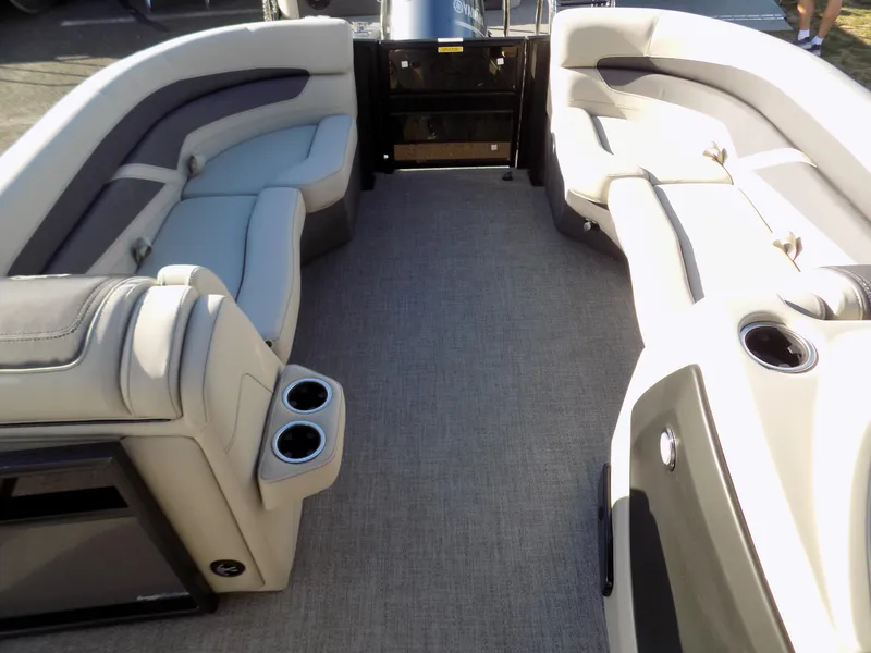 Slide: The Image of 2023 Barletta C22CC boat interior with spacious seating and cup holders. - 5