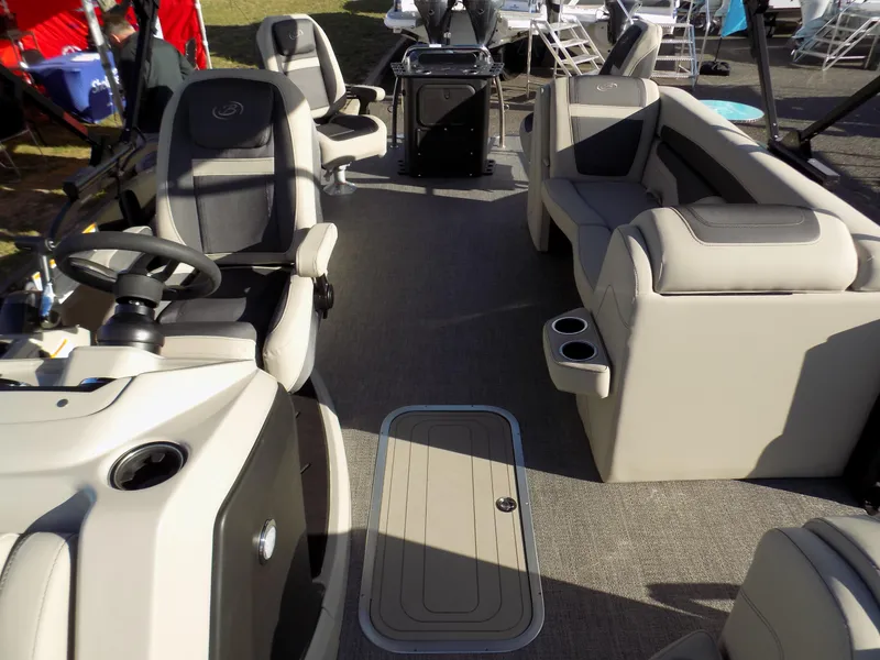 Slide: The Image of 2023 Barletta C22CC pontoon boat interior with plush seating and modern helm. - 6