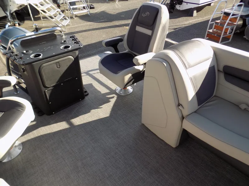 Slide: The Image of 2023 Barletta C22CC boat interior with seating and control console. - 9
