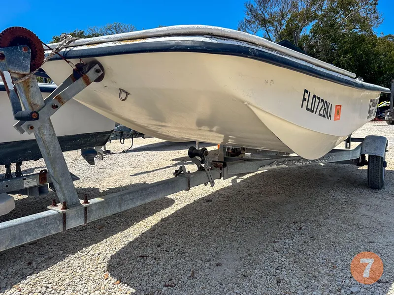 Slide: The Image of 1998 Carolina Skiff J12 Skiff on a trailer, side view. - 14