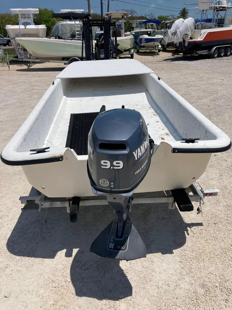 Slide: The Image of 1998 Carolina Skiff J12 Skiff with Yamaha 9.9 outboard motor. - 3