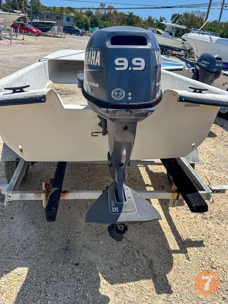 Slide: The Image of 1998 Carolina Skiff J12 with Yamaha 9.9 outboard motor on trailer. - 8