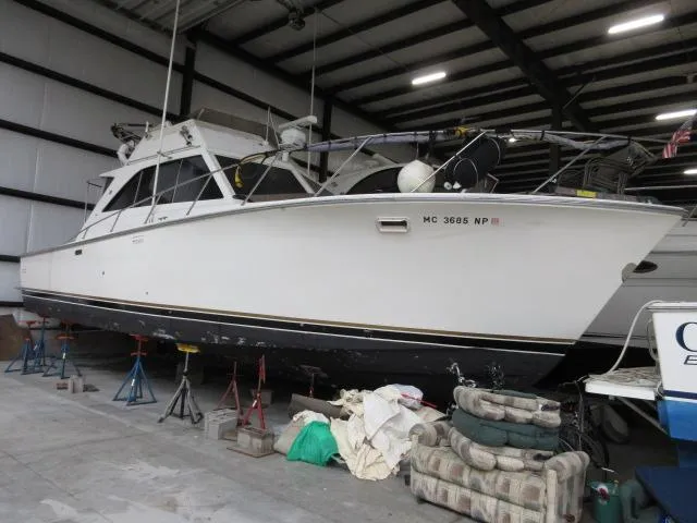 Slide: The Image of 1978 Pacemaker 40 Sport Fish boat in indoor storage on stands. - 0