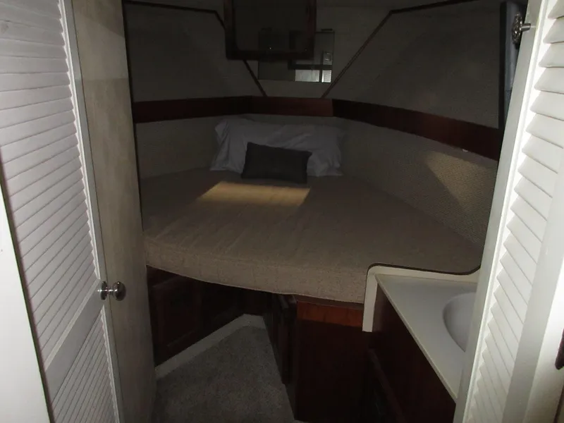 Slide: The Image of 1978 Pacemaker 40 Sport Fish boat cabin with bed and sink. - 23