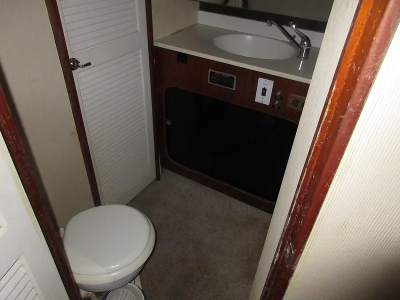 Slide: The Image of 1978 Pacemaker 40 Sport Fish bathroom with sink and toilet. - 28