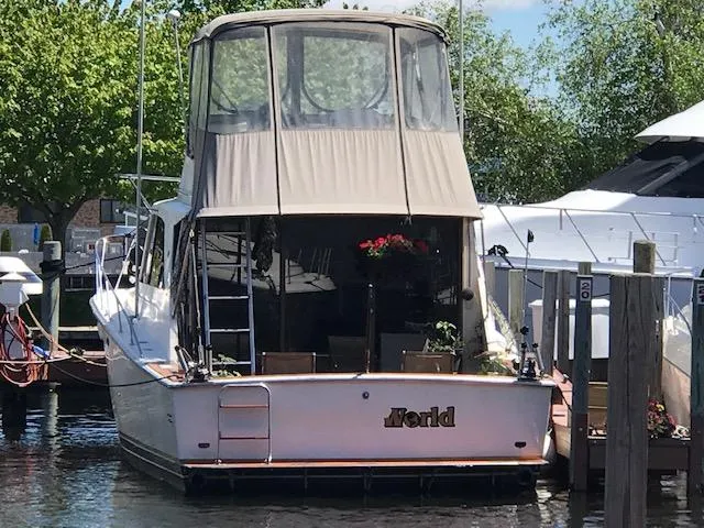 Slide: The Image of 1978 Pacemaker 40 Sport Fish boat docked at marina with covered upper deck. - 3