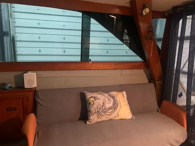 Slide: The Image of Interior of 1978 Pacemaker 40 Sport Fish boat with sofa and decorative pillow. - 35