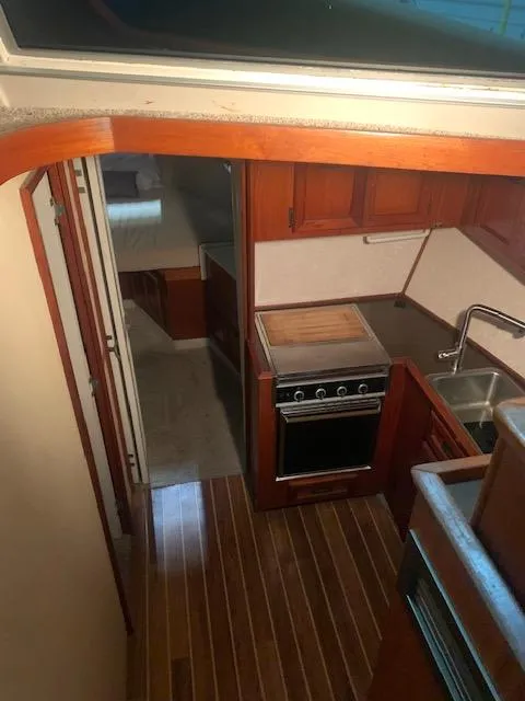 Slide: The Image of 1978 Pacemaker 40 Sport Fish interior kitchen and hallway view. - 36