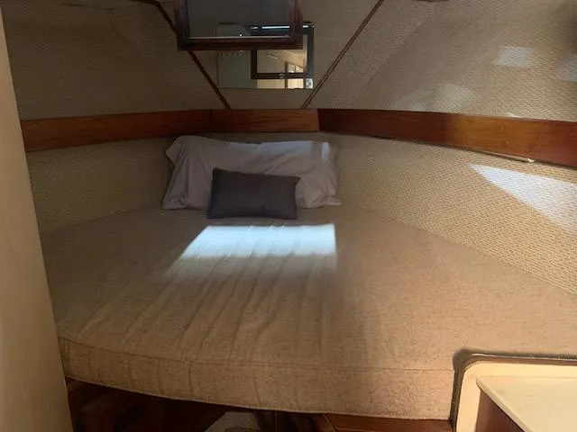 Slide: The Image of 1978 Pacemaker 40 Sport Fish cabin interior with bed and pillows. - 39