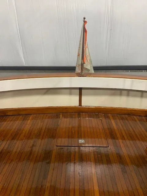 Slide: The Image of 1978 Pacemaker 40 Sport Fish boat with polished wooden deck and small sail. - 42