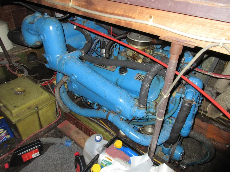 Slide: The Image of 1978 Pacemaker 40 Sport Fish engine compartment with blue engine and various components. - 45