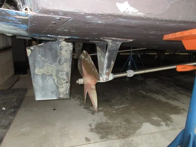 Slide: The Image of 1978 Pacemaker 40 Sport Fish boat propeller and rudder in dry dock. - 46