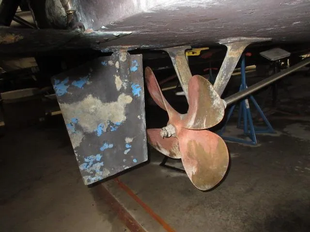 Slide: The Image of Close-up of the propeller and rudder of a 1978 Pacemaker 40 Sport Fish boat. - 47