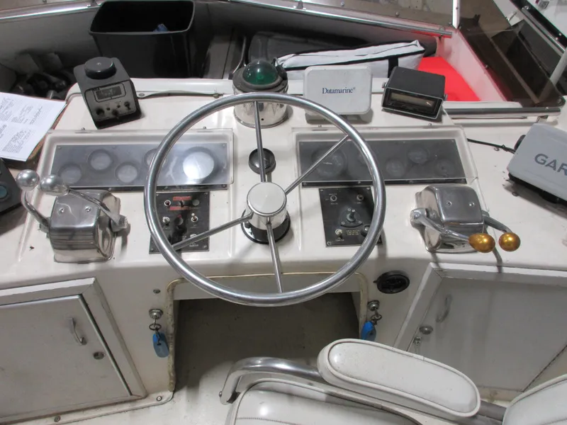 Slide: The Image of 1978 Pacemaker 40 Sport Fish boat helm with steering wheel and control panels. - 6