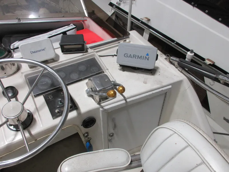 Slide: The Image of 1978 Pacemaker 40 Sport Fish boat helm with Garmin navigation system. - 8