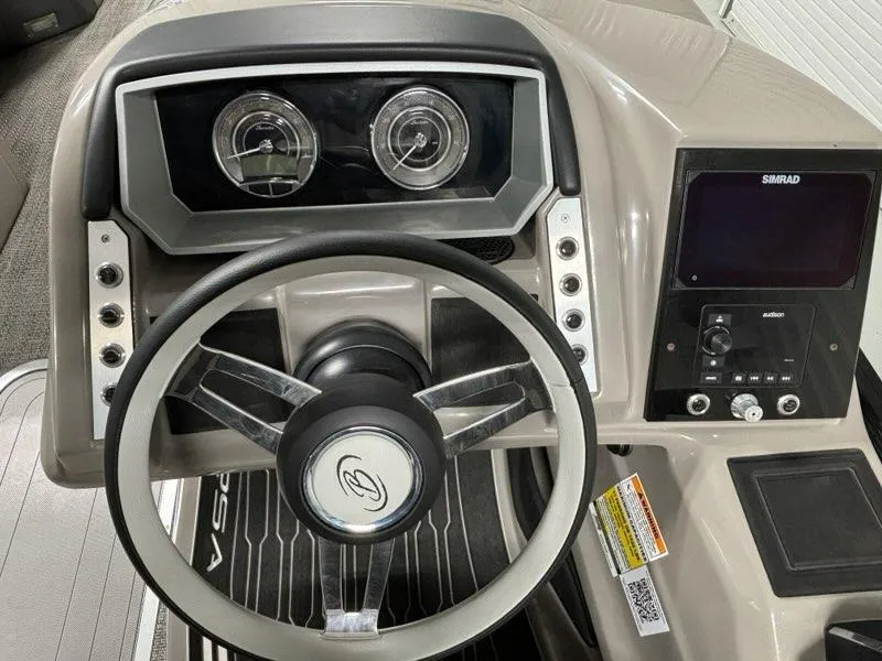Slide: The Image of 2024 Barletta Corsa 23UA dashboard with steering wheel and control panel. - 2