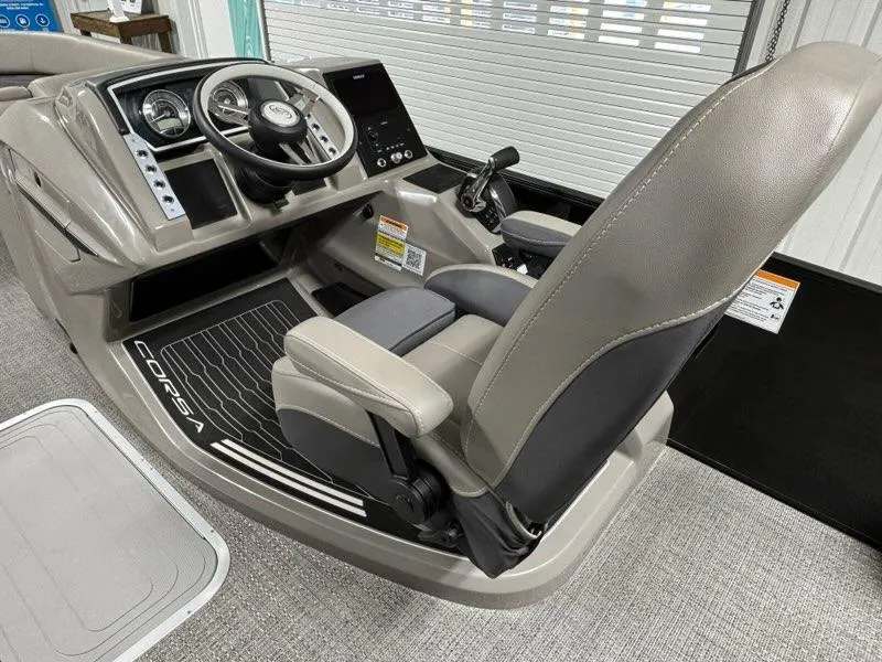 Slide: The Image of 2024 Barletta Corsa 23UA boat cockpit with steering wheel and captain's chair. - 3