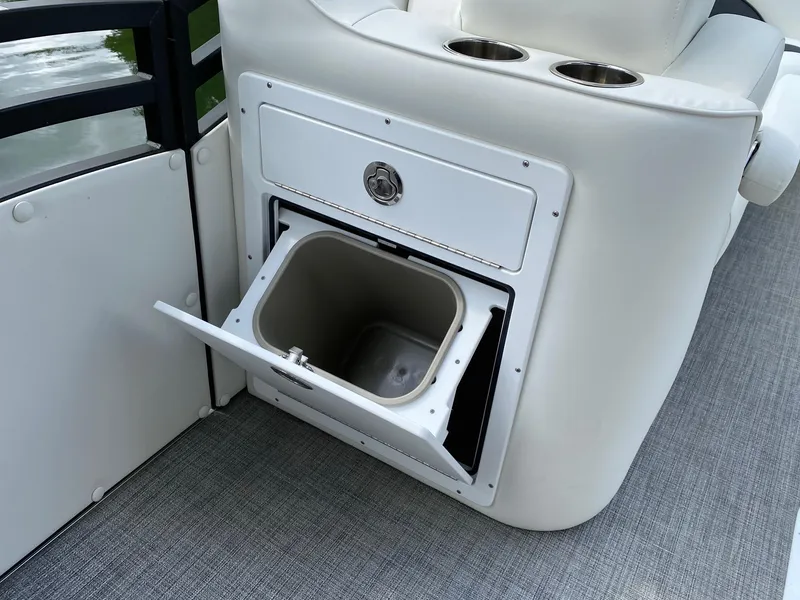 Slide: The Image of 2023 JC Neptoon Sport 23TT boat with built-in storage compartment and cup holders. - 10